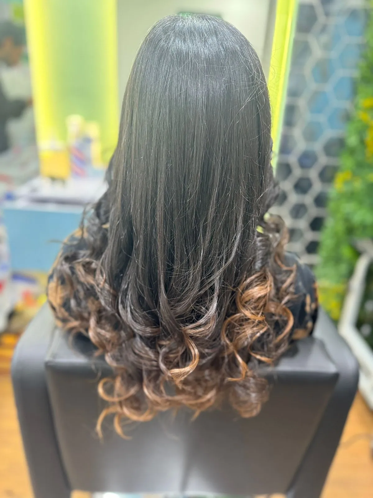 Stylish hair styling with elegant curls at Cut Cut Crafters - Hair, Skin, and Nails Salon in Virar